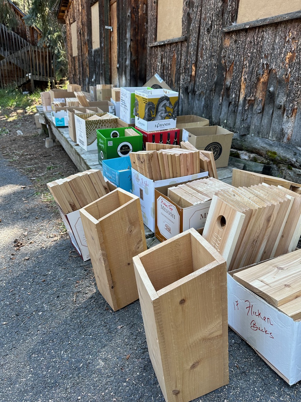 nestbox parts in boxes outside next to old barn
