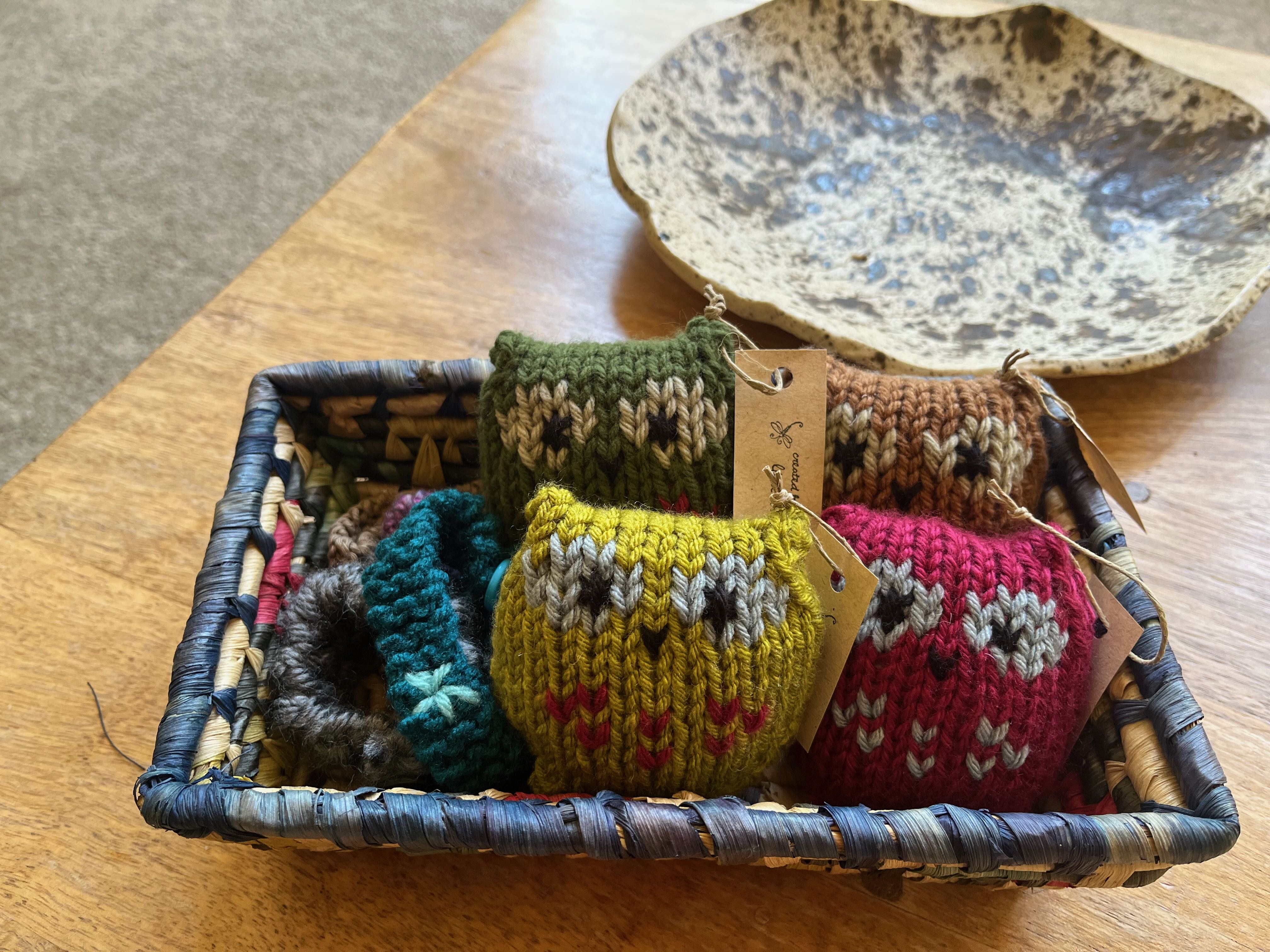 knitted mini owls in a basket