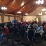 people at a meeting inside